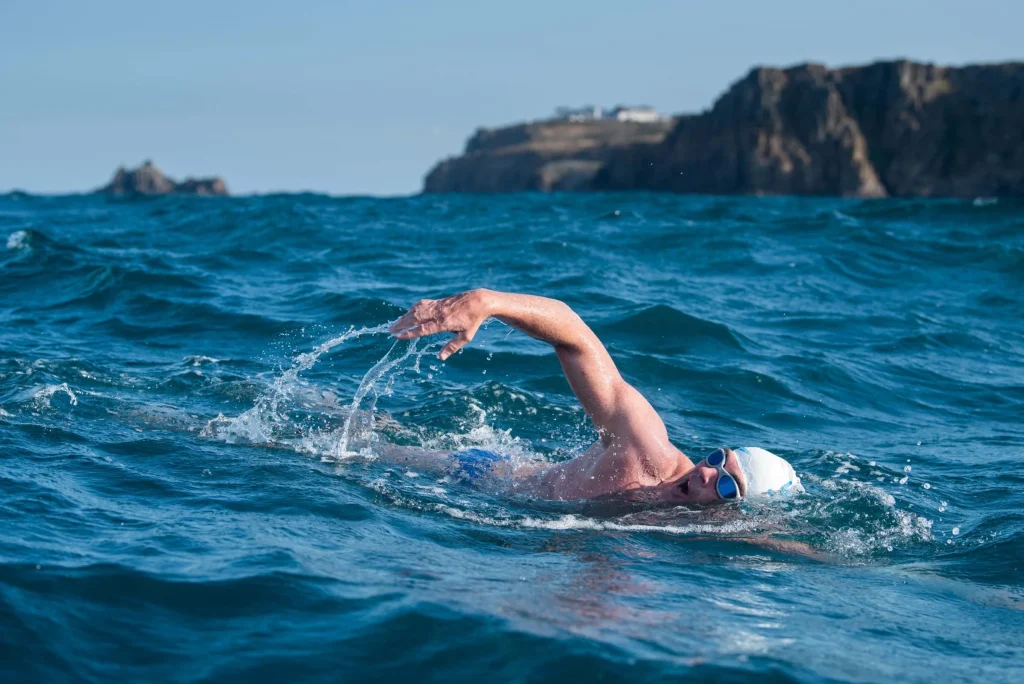 a man swiming in the ocean