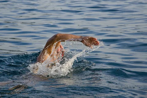 a man swiming in the ocean 3