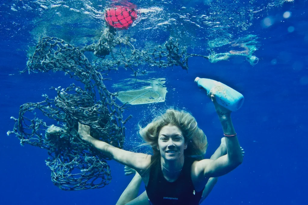 a women swimming in the sea to Clean the Ocean